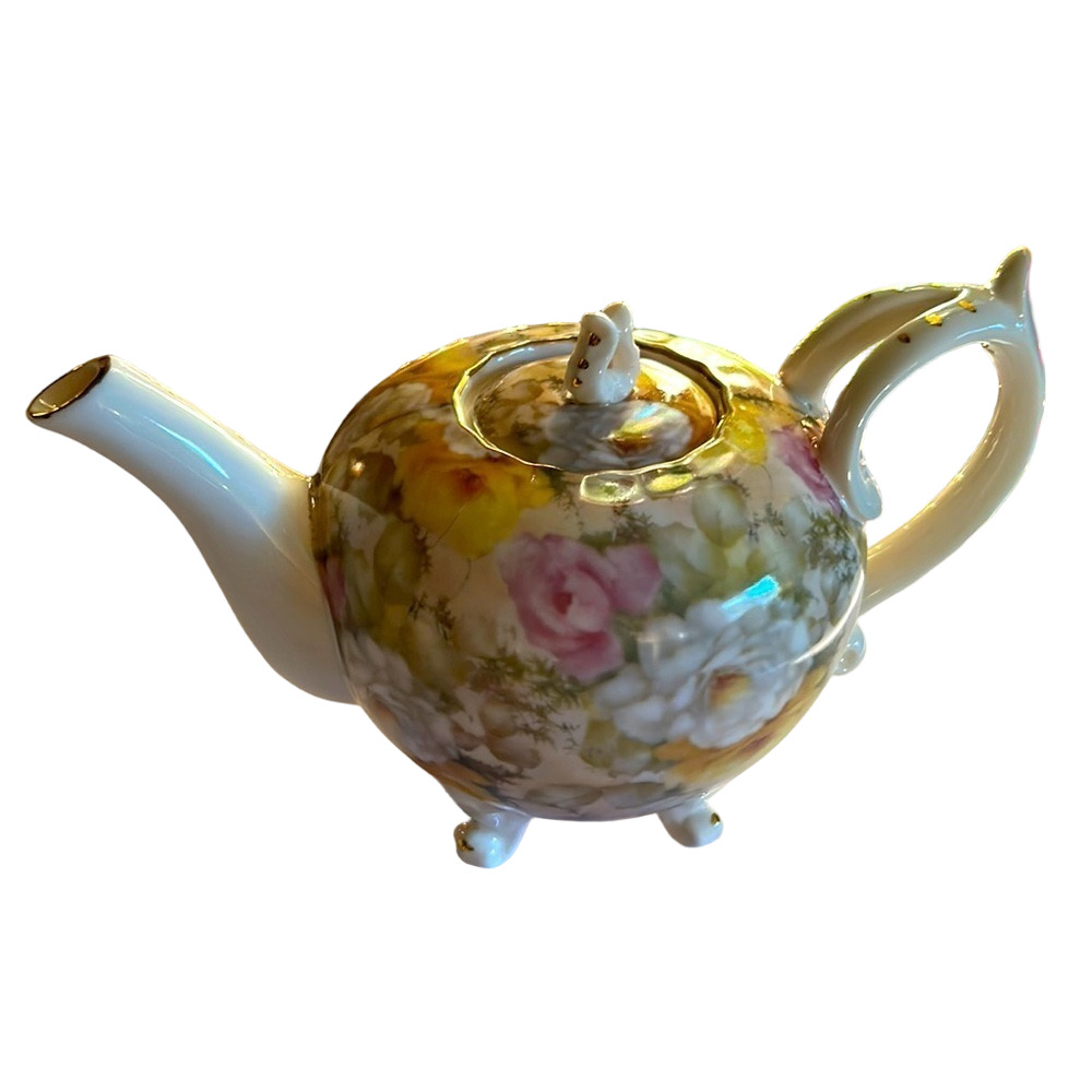 Gold trimmed Porcelain Floral Graces tea pot.
Vintage before 2000. New.